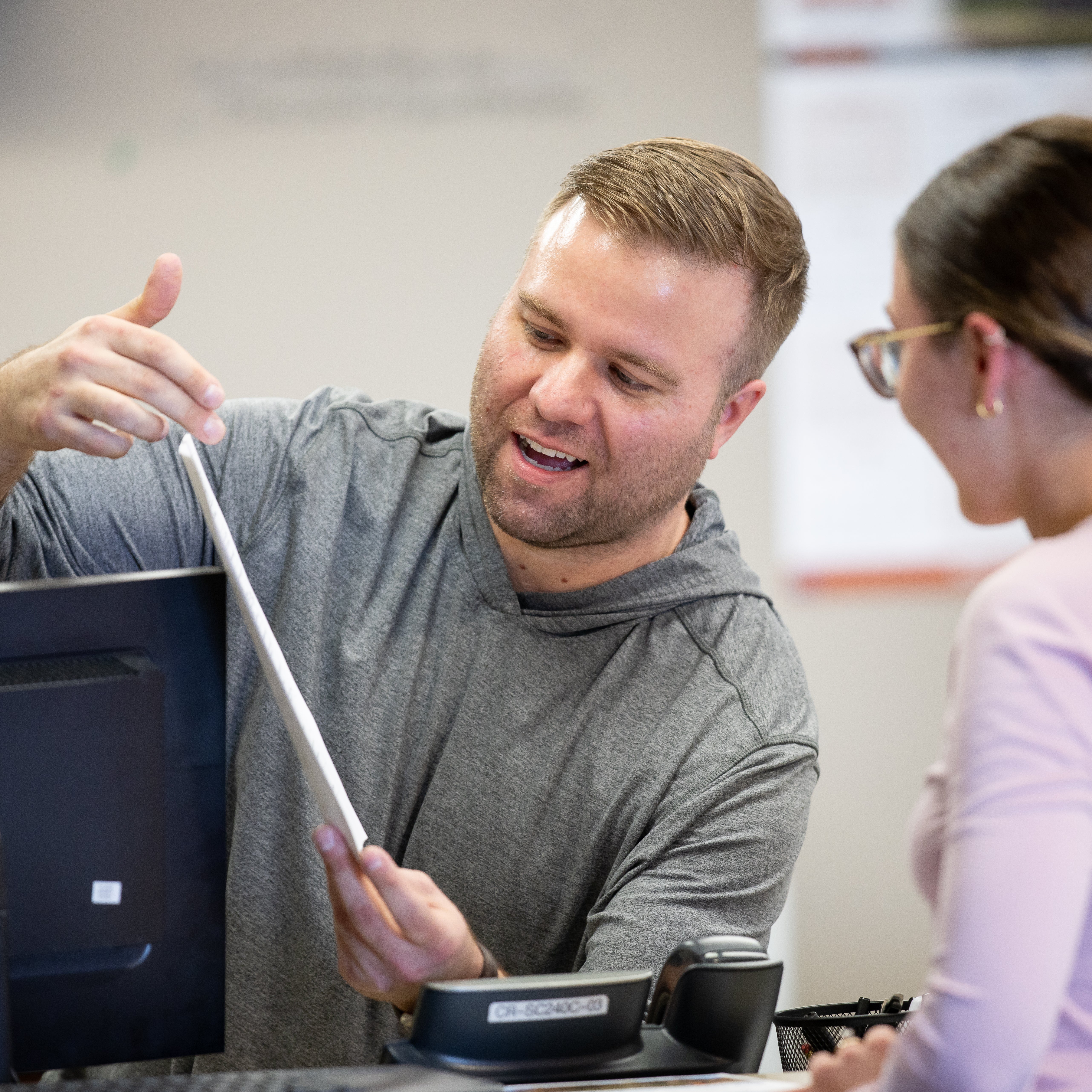 Financial Aid staff member talks to student