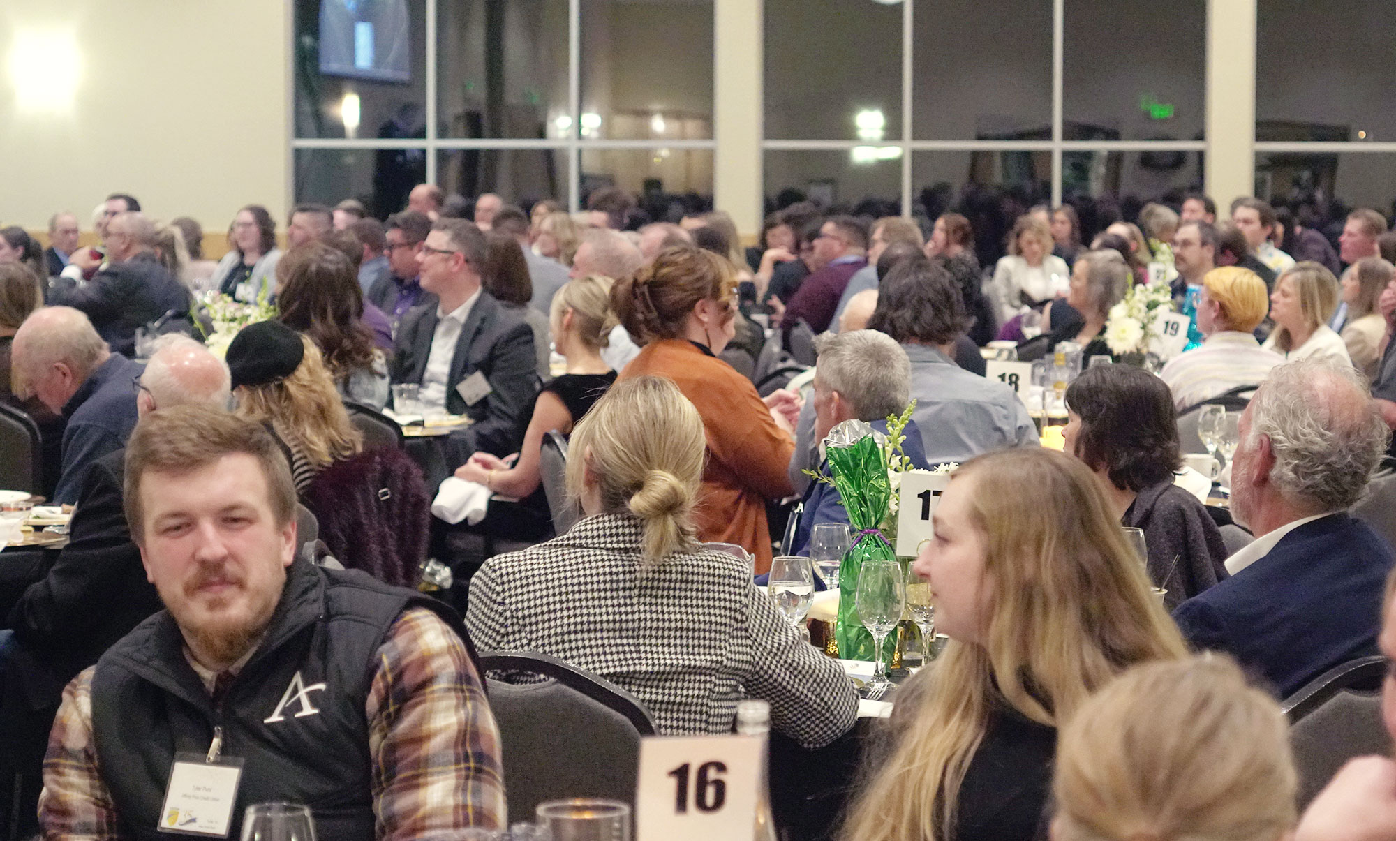 Crowd Attending Scholardazzle Event Sitting at Tables in Large Room