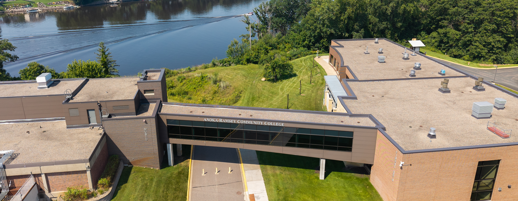 Skyway coon rapids campus aerial view river with boat