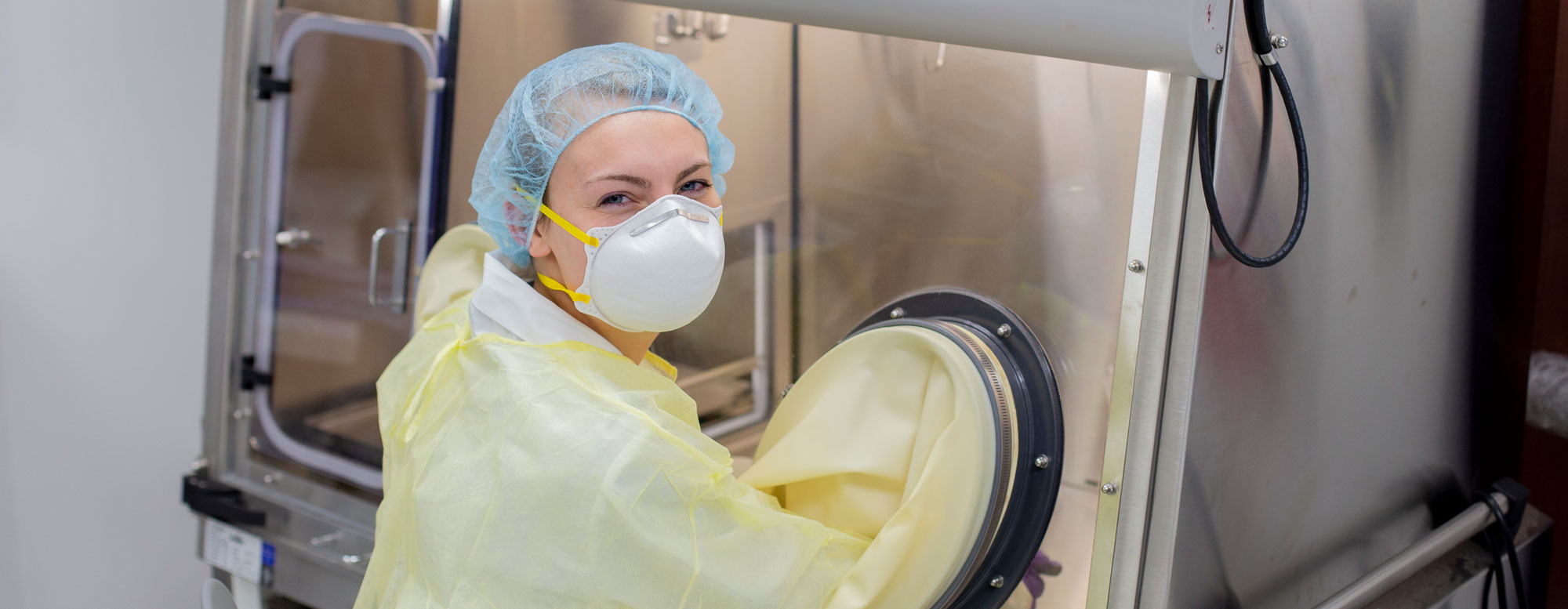 Pharmacy student training in sterile compounding hood
