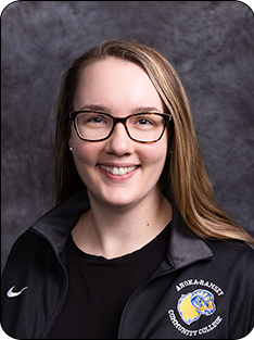 Anna Sorgert Individual wearing Anoka-Ramsey branded jacket