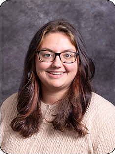 McKenzie Johnson Individual wearing cream colored sweater
