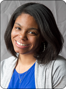 DeLisa Bolden Individual wearing gray sweater over blue shirt