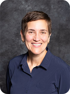 Individual wearing blue shirt with collar
